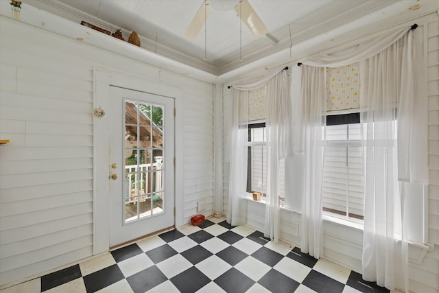 doorway featuring ceiling fan