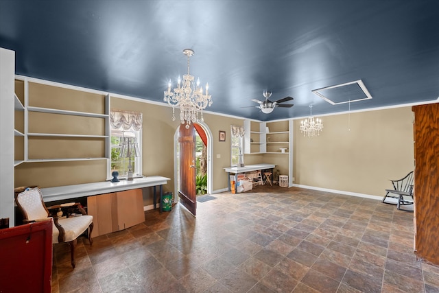 interior space with built in shelves, ceiling fan, and crown molding