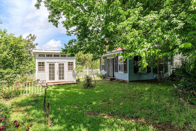 view of yard featuring french doors