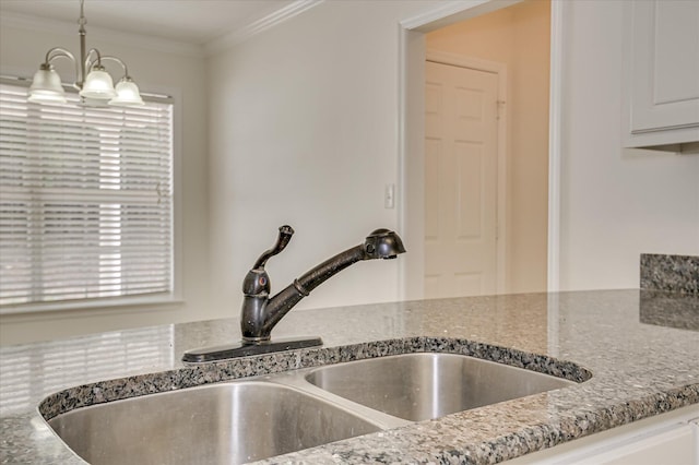392 Sandleton Way, Evans, GA 30809 - kitchen view of stone countertops, ornamental molding, white cabinetry, pendant lighting, and a chandelier