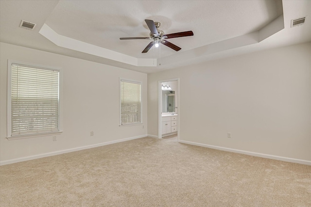 392 Sandleton Way, Evans, GA 30809 - unfurnished room with a raised ceiling, light colored carpet, ceiling fan, and healthy amount of natural light