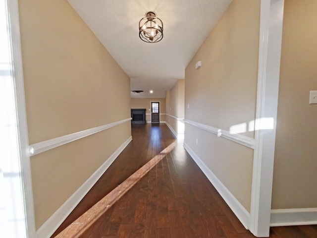 corridor with dark wood-type flooring