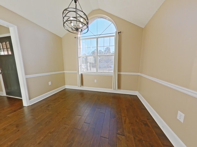 unfurnished dining area with vaulted ceiling, an inviting chandelier, and dark hardwood / wood-style flooring