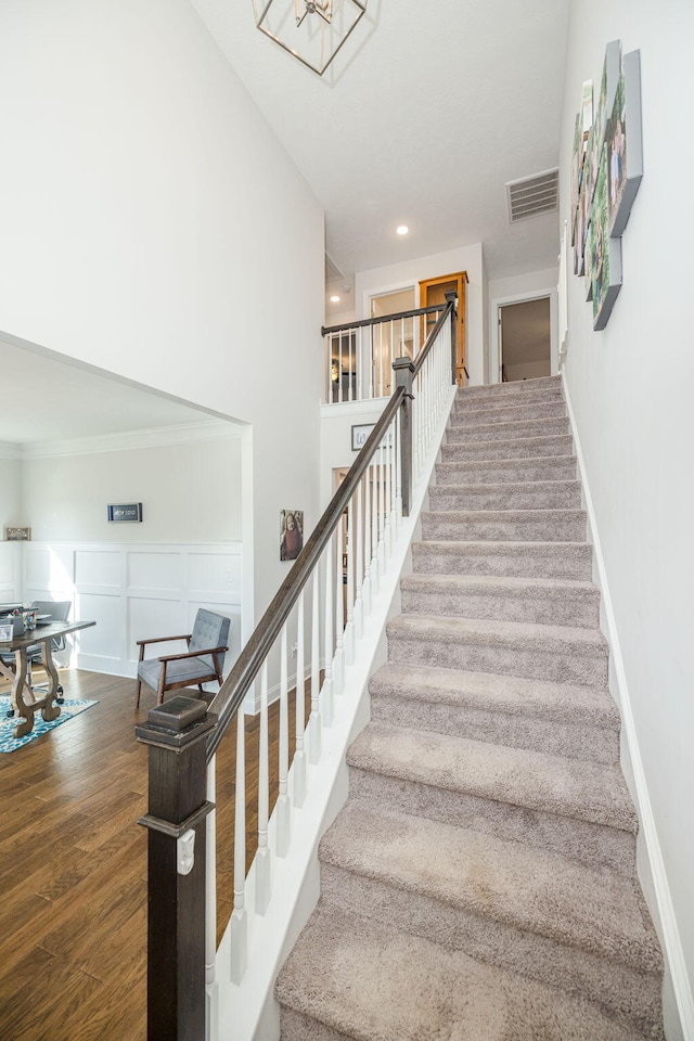 stairway featuring wood-type flooring