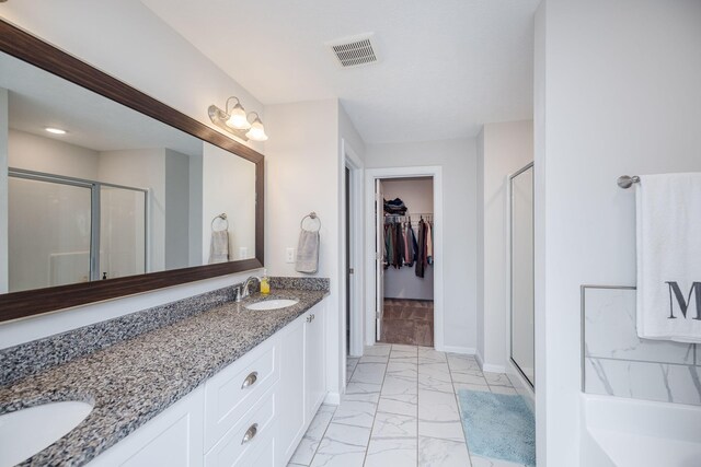 bathroom with vanity and walk in shower