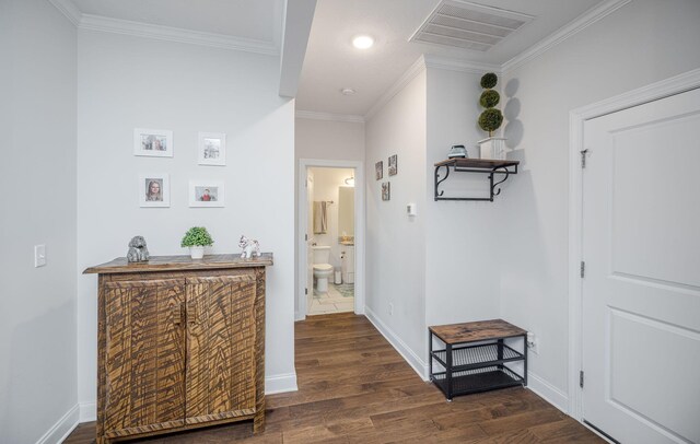 hall featuring crown molding and dark wood-type flooring