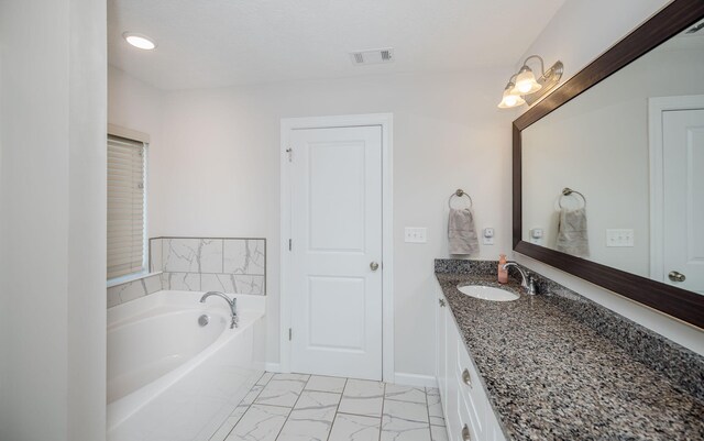 bathroom featuring a bathtub and vanity