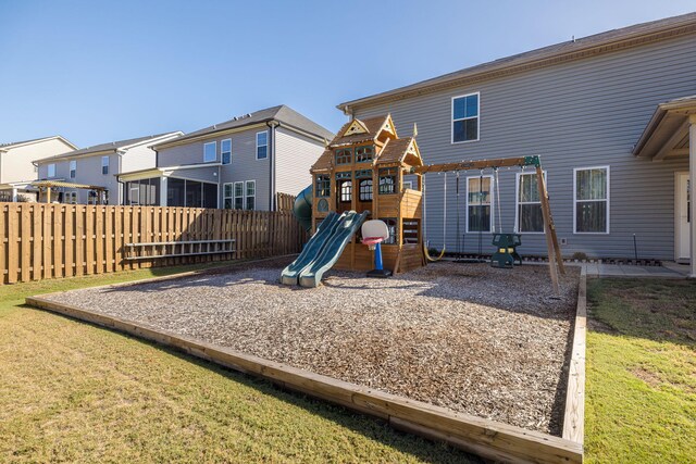 view of play area with a pergola and a yard