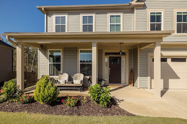 view of front of house with covered porch and a garage