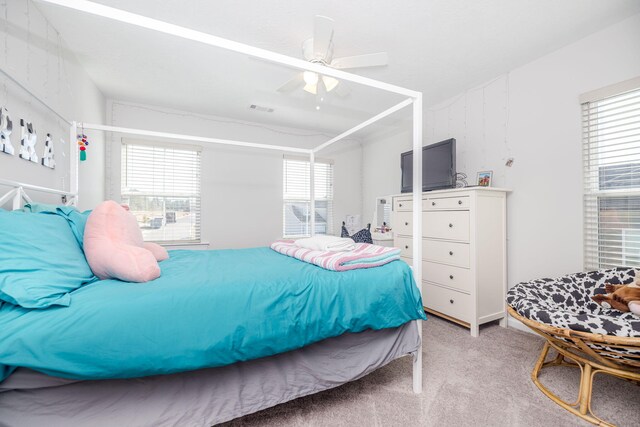 carpeted bedroom featuring ceiling fan