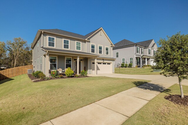 view of front of property with central AC, a front lawn, a porch, and a garage