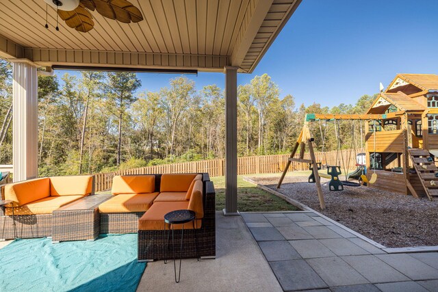 view of patio with outdoor lounge area, ceiling fan, and a playground