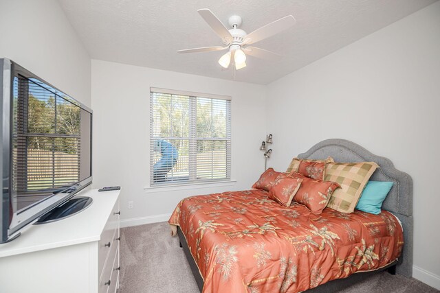 bedroom featuring ceiling fan and light carpet