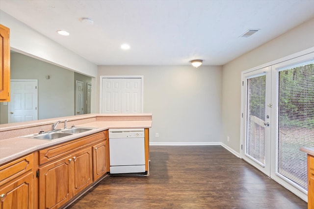 kitchen with visible vents, dishwasher, a sink, dark wood-style flooring, and french doors