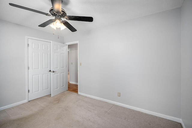 134 Robin Rd, Barnwell, SC 29812 - unfurnished bedroom with light carpet, ceiling fan, and a closet