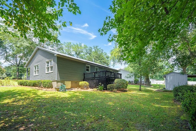 134 Robin Rd, Barnwell, SC 29812 - rear view of property featuring a deck, a storage unit, a yard, and crawl space