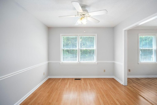 134 Robin Rd, Barnwell, SC 29812 - spare room featuring light wood-style floors, a textured ceiling, and a ceiling fan