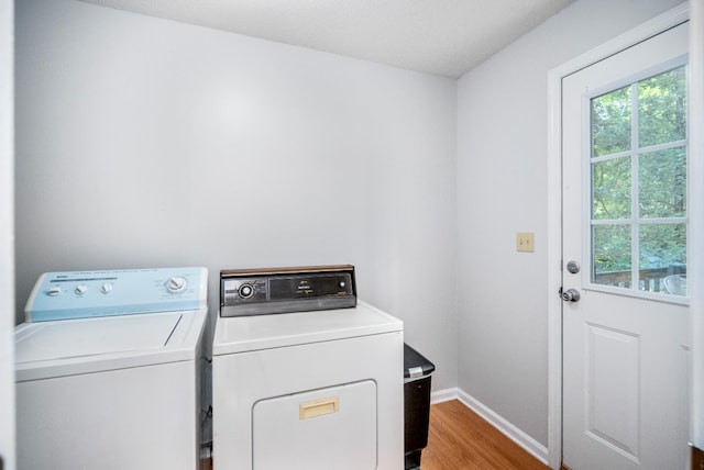 134 Robin Rd, Barnwell, SC 29812 - laundry area with washing machine and clothes dryer, plenty of natural light, and wood finished floors