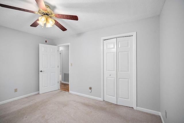 134 Robin Rd, Barnwell, SC 29812 - unfurnished bedroom featuring light colored carpet, a closet, and a ceiling fan