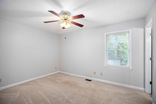 134 Robin Rd, Barnwell, SC 29812 - empty room featuring carpet floors, a ceiling fan, and a textured ceiling