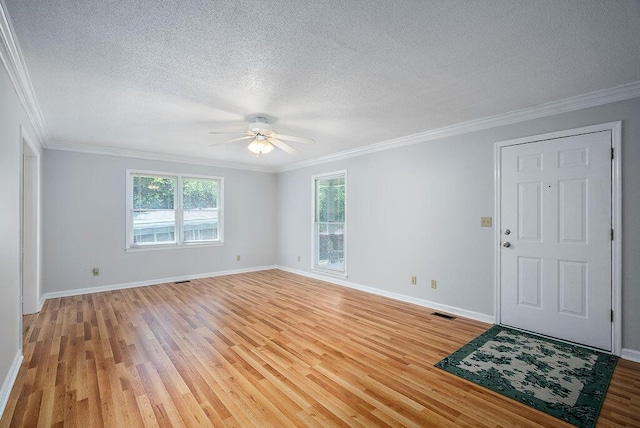 134 Robin Rd, Barnwell, SC 29812 - spare room featuring ceiling fan, light wood-style floors, ornamental molding, and a textured ceiling