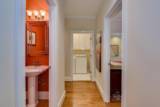3501 Lonesome Pine Ct, Martinez, GA 30907 - hall featuring independent washer and dryer, crown molding, light wood-style flooring, a sink, and baseboards
