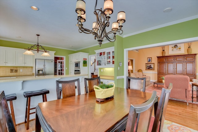3501 Lonesome Pine Ct, Martinez, GA 30907 - dining space with a chandelier, ornamental molding, and light wood-style flooring