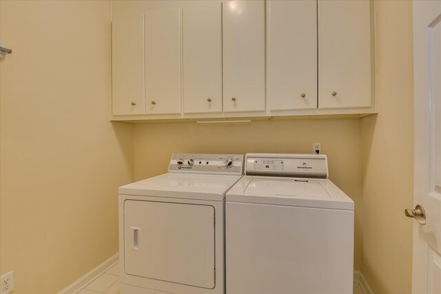 3501 Lonesome Pine Ct, Martinez, GA 30907 - laundry area with independent washer and dryer, cabinet space, baseboards, and tile patterned flooring