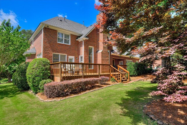 3501 Lonesome Pine Ct, Martinez, GA 30907 - rear view of house featuring brick siding, a chimney, a deck, a yard, and roof with shingles