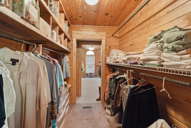 spacious closet featuring visible vents and carpet