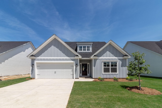 view of front of house with driveway, a shingled roof, an attached garage, board and batten siding, and a front yard