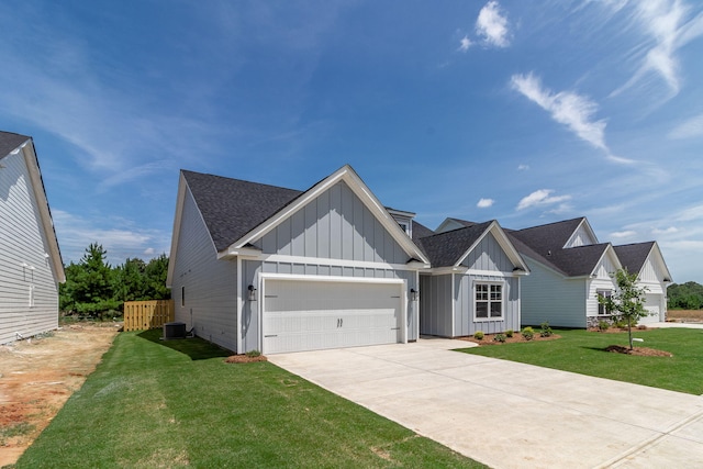 view of front of home featuring board and batten siding, a front lawn, central AC, and a garage