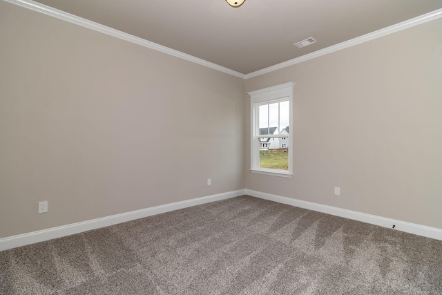 unfurnished room featuring baseboards, carpet, visible vents, and crown molding