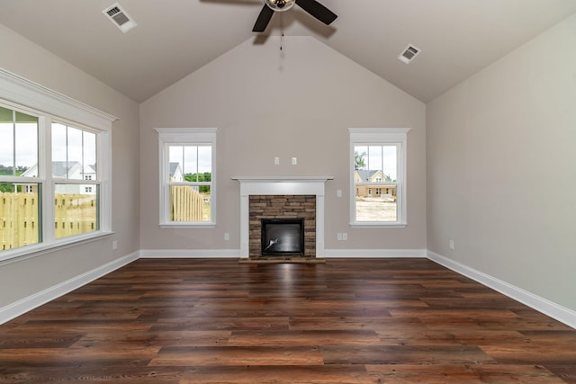 unfurnished living room with baseboards, a fireplace, visible vents, and dark wood finished floors