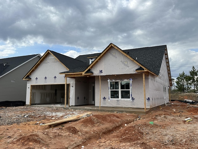 unfinished property with an attached garage