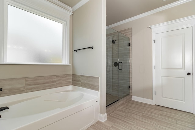 full bath with baseboards, a shower stall, ornamental molding, and a bath