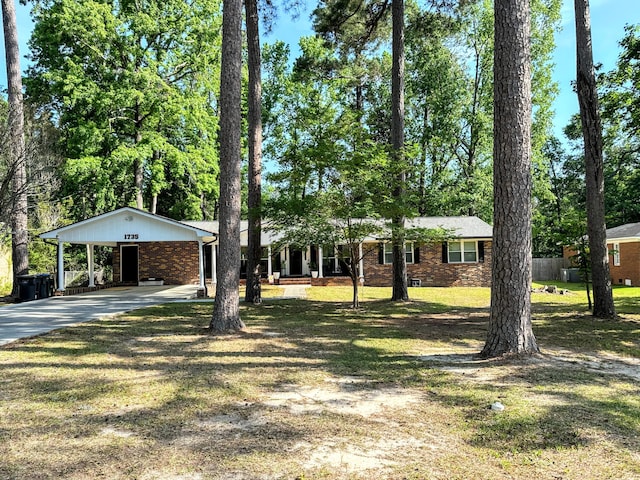 1735 Goshen Rd, Augusta, GA 30906 - ranch-style home featuring driveway, brick siding, a front lawn, and a carport