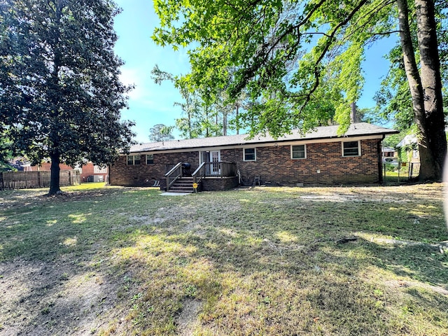 1735 Goshen Rd, Augusta, GA 30906 - back of property featuring crawl space, fence, brick siding, and a lawn