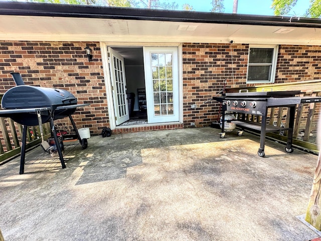1735 Goshen Rd, Augusta, GA 30906 - view of exterior entry with a patio area and brick siding