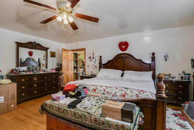 bedroom with ceiling fan and light hardwood / wood-style floors