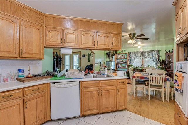 kitchen featuring ceiling fan, white appliances, sink, and light tile patterned floors