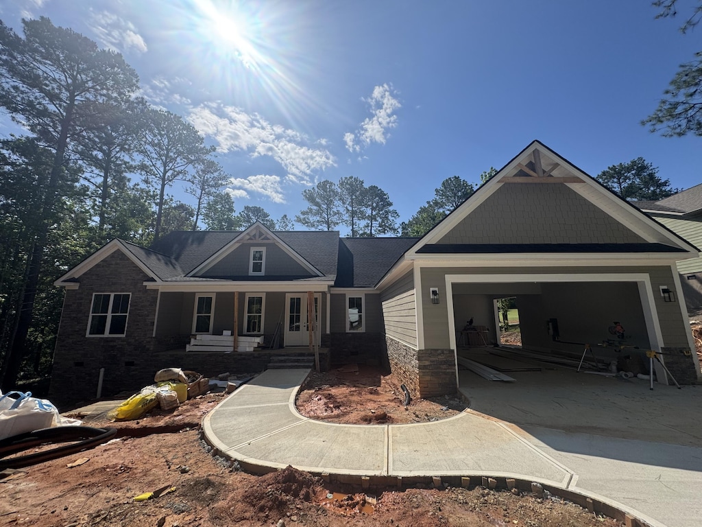 314 Hancock Cir, Mccormick, SC 29835 - view of front facade featuring a garage, concrete driveway, and a porch