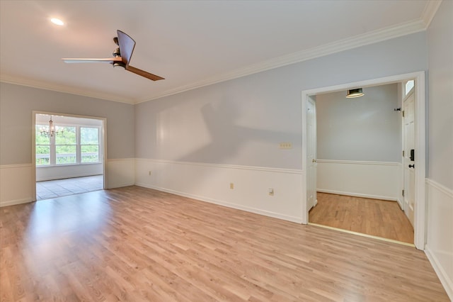 227 Water Oak Dr, Augusta, GA 30904 - spare room with a ceiling fan, light wood-style floors, ornamental molding, wainscoting, and a chandelier