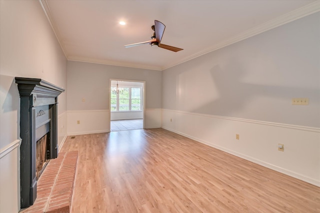 227 Water Oak Dr, Augusta, GA 30904 - unfurnished living room featuring a ceiling fan, ornamental molding, a fireplace, and light wood-style flooring