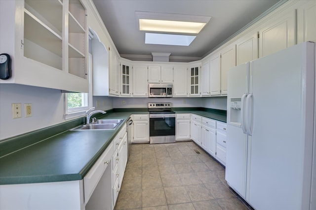 227 Water Oak Dr, Augusta, GA 30904 - kitchen featuring appliances with stainless steel finishes, dark countertops, white cabinetry, and ornamental molding