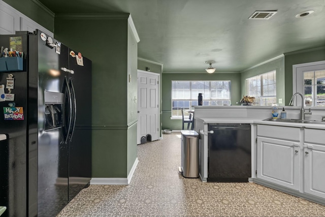 kitchen with crown molding, visible vents, a sink, and black appliances