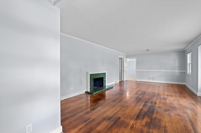 2203 Crestwood Dr, Augusta, GA 30904 - unfurnished living room featuring hardwood / wood-style flooring, ornamental molding, and a fireplace