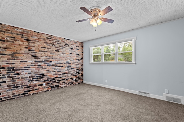 2203 Crestwood Dr, Augusta, GA 30904 - spare room featuring brick wall, carpet floors, and ceiling fan