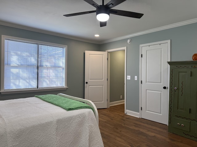 bedroom with ceiling fan, baseboards, dark wood-style flooring, and ornamental molding