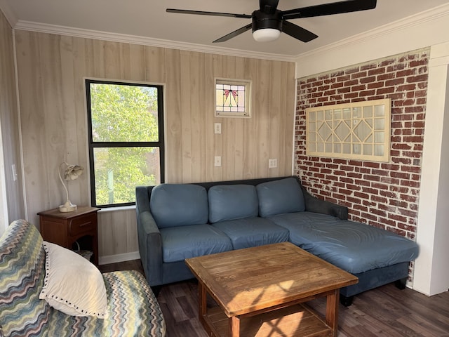 living room with crown molding, ceiling fan, and wood finished floors